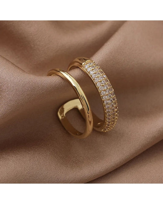 Lilyah Jewelry Gold Plated Zircon Diamond Ring. adjustable promise ring. accents of gold and diamonds.
Two layers to the ring, one gold plated band and the other has diamonds.