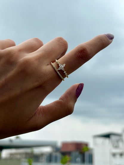 Lilyah Jewelry Gold Plated Zircon Diamond Ring.  Two layers and adjustable promise ring. Hand wearing a gold ring with a diamond against a blurred outdoor background