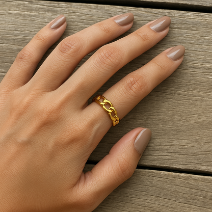 A gold-plated chain link open ring on a person's hand, with the ring's adjustable band visible. Lilyah Jewelry Gold Plated Ring . Stunning, minimalistic, adjustable, elegant and statement ring. Gift idea for her.