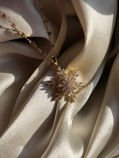 Lilyah Jewelry Gold Plated Zircon Diamond Adjustable Necklace. Stunning and elegant. Gift for her -necklace with a snowflake pendant on beige fabric