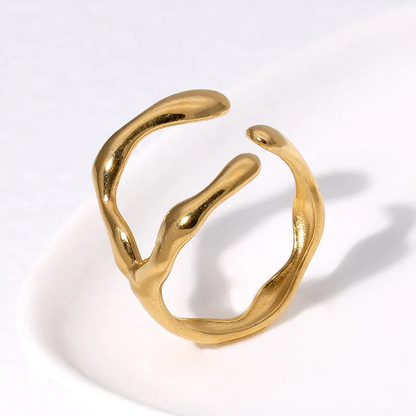 An 18K gold plated stainless steel open ring with an abstract design, displayed on a white background. Lilyah Jewelry Gold Plated Ring . Stunning, minimalistic, adjustable, elegant and statement ring. Gift idea for her.