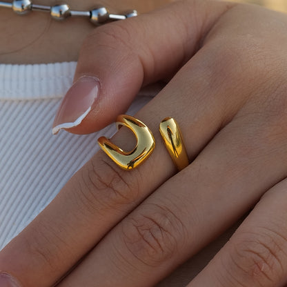 A gold-plated open ring on a person's finger, displaying a minimalistic and elegant design. Lilyah Jewelry Gold Plated Ring . Stunning, minimalistic, adjustable, elegant and statement ring. Gift idea for her.