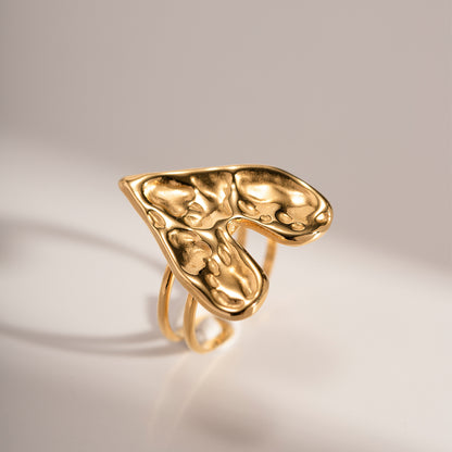 An 18k gold plated hammering heart open ring with a smooth finish on a white background. Lilyah Jewelry Gold Plated Ring . Stunning, minimalistic, adjustable, elegant and statement ring. Gift idea for her.