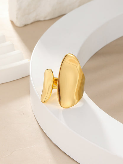 A gold-plated asymmetrical open ring on a white surface. Lilyah Jewelry Gold Plated Ring . Stunning, minimalistic, adjustable, elegant and statement ring. Gift idea for her.