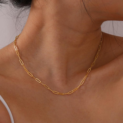 A close-up image of a person wearing a 18k gold plated minimalistic chain necklace. Lilyah Jewelry Gold Plated necklace. Gift Ideas for her.