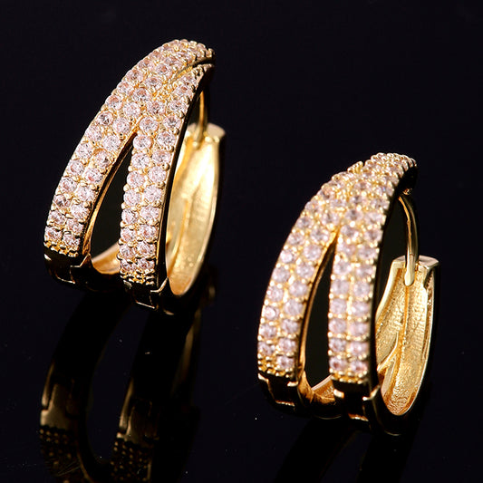 Lilyah Jewelry Gold Plated Diamond Earrings.  Double hoop earrings with clear gemstones on a black background