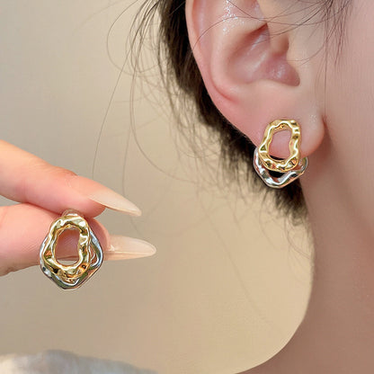 Lilyah Jewelry Gold Plated Earrings.  detachable earrings being worn on an ear with a neutral background