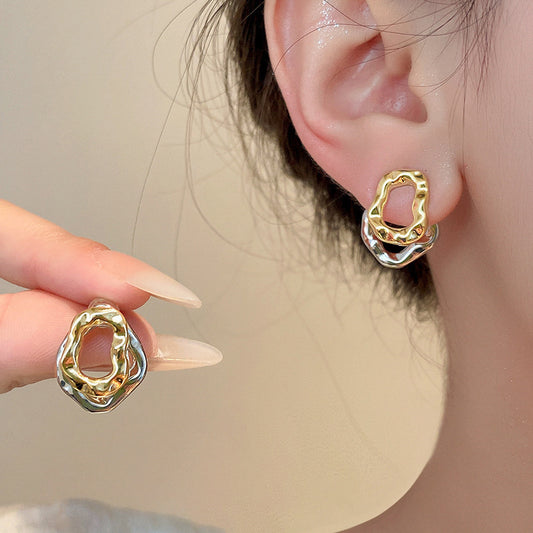 Lilyah Jewelry Gold Plated Earrings.  detachable earrings being worn on an ear with a neutral background