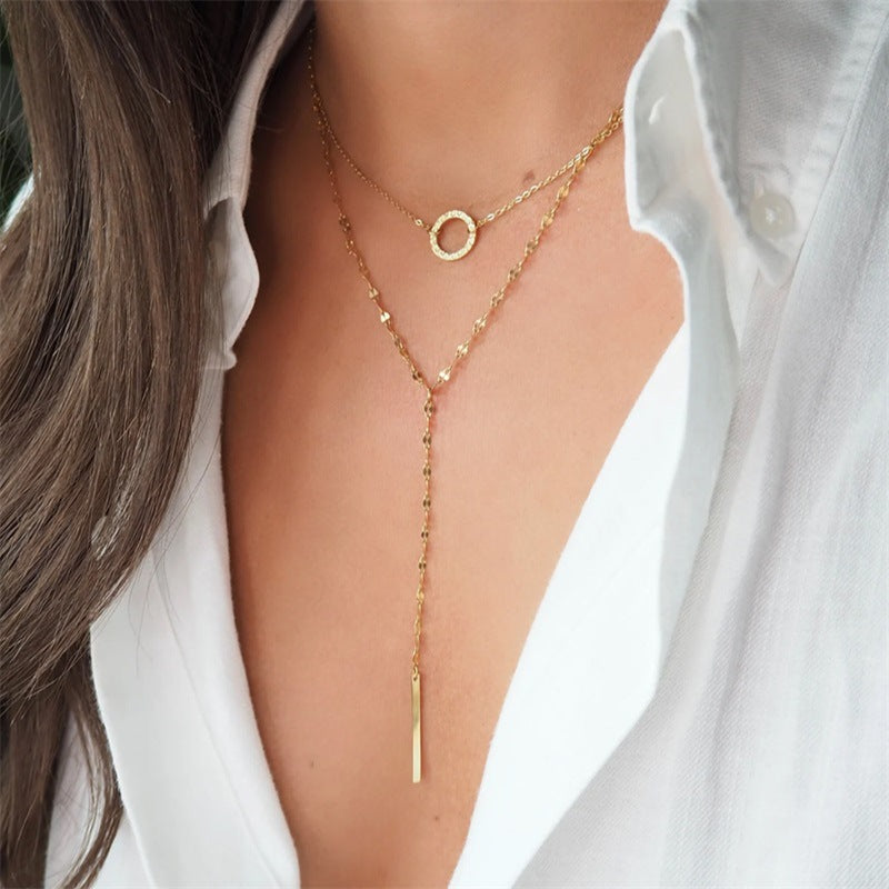 Lilyah Jewelry Gold Plated Necklaces. Two necklace set. Gold necklaces on a person wearing a white shirt