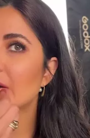 Close-up of a woman with dark hair and earrings, Lilyah Jewelry Gold Plated Earring. Gift Ideas for her.