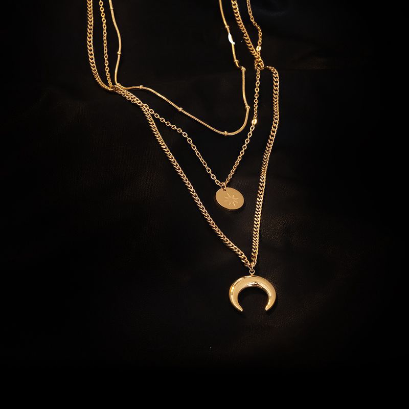 Lilyah Jewelry Gold Plated Necklace. Gift Ideas for her. it has a beautiful golden shine, triple layered, sun, moon and tine beads that add nice layers to the necklace.