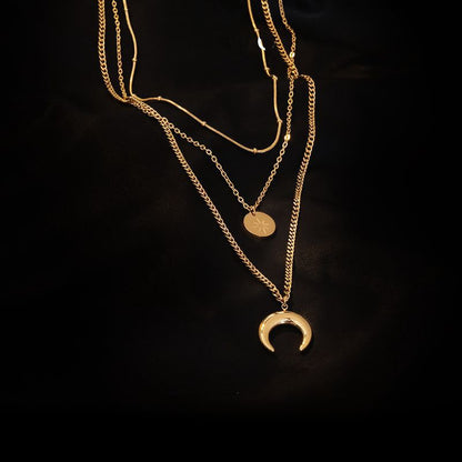 Lilyah Jewelry Gold Plated Necklace. Gift Ideas for her. it has a beautiful golden shine, triple layered, sun, moon and tine beads that add nice layers to the necklace.