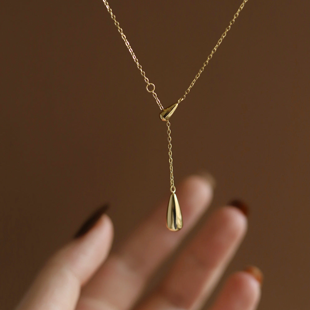 Lilyah Jewelry Gold Plated Necklace. Gift Ideas for her. It has two drop shaped golden drops. It is an adjustable necklace.