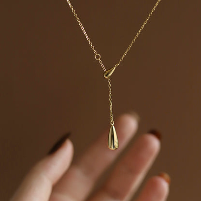Lilyah Jewelry Gold Plated Necklace. Gift Ideas for her. It has two drop shaped golden drops. It is an adjustable necklace.